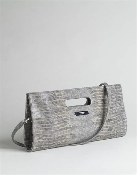 does michael kors use fake snakeskin clutch|michael kors bag counterfeit.